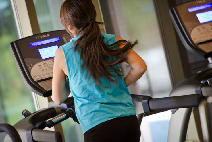 A person exercising on a treadmill.